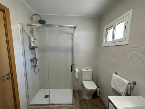 a bathroom with a shower and a toilet at Casa L'Avi in Plegamans