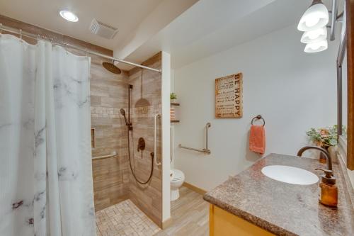 a bathroom with a shower and a toilet and a sink at The Haven at Welsh Mountain Suites - Apt with Patio! in New Holland