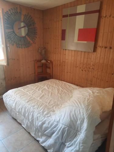 Llit o llits en una habitació de Petite maison de caractere