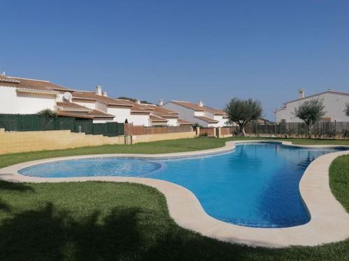 a swimming pool in a yard with houses at Casa Leti in Benitachell