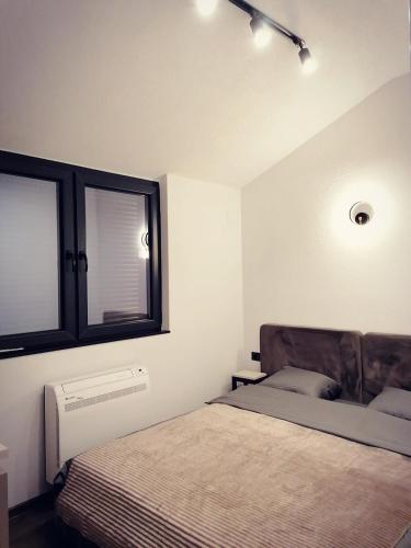 Katil atau katil-katil dalam bilik di Vineyard Apartment