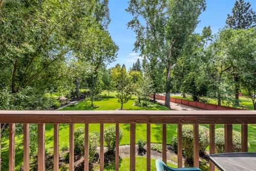 a balcony with a view of a park at Pioneer Park Rentals Downtown Bend in Bend