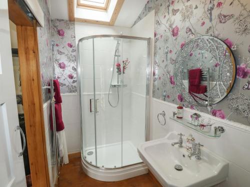 a bathroom with a shower and a sink at Turnpike Lodge in Paignton