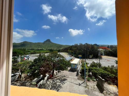 a view from a window of a parking lot at Dajenshan Hotel in Kenting