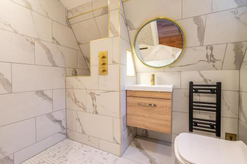 a bathroom with a sink and a mirror at 34 Coney Street in York