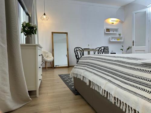 Ένα ή περισσότερα κρεβάτια σε δωμάτιο στο Downtown Residence