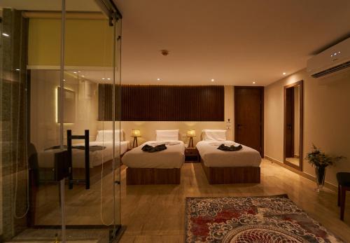 Cama o camas de una habitación en New Pyramid Front Hotel