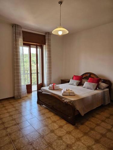 a bedroom with a large bed in a room at Casa vacanze Moretto in Ceglie Messapica
