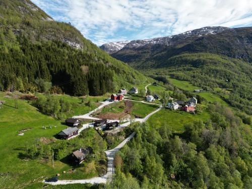 a valley with a village in the mountains at Stalheim Fjord og Fjellhytter in Stalheim