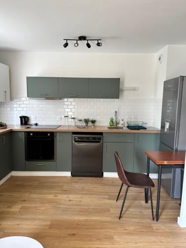 Kuchyň nebo kuchyňský kout v ubytování Bel appartement à 25 mn de Paris
