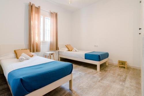 Ένα ή περισσότερα κρεβάτια σε δωμάτιο στο Apartamentos Verdera Es Pujols