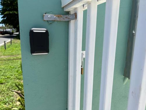 a mailbox on the side of a blue building at Aguada Beach Condos in Aguada