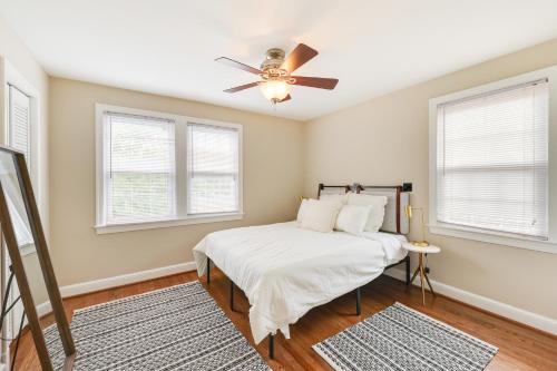 a bedroom with a bed and a ceiling fan at Modern Alexandria Townhome about 2 Mi to Old Town! in Alexandria