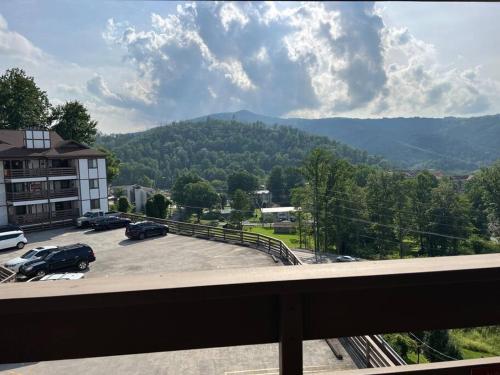 a view of a parking lot with mountains in the background at CITY & MOUNTAIN VIEW 5 Mins from downtown Gatlinburg in Gatlinburg