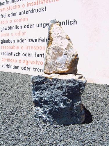 a rock sitting on top of a pile of gravel at Casa Oscar - Apartment in El Roque