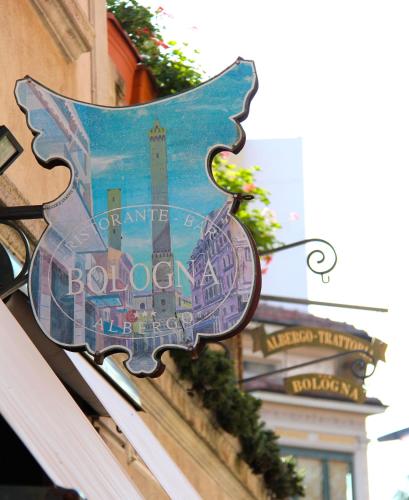 a sign on the side of a building at Albergo Bologna in Varese