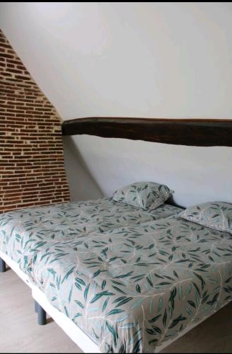 Una cama o camas en una habitación de Gite écurie familly