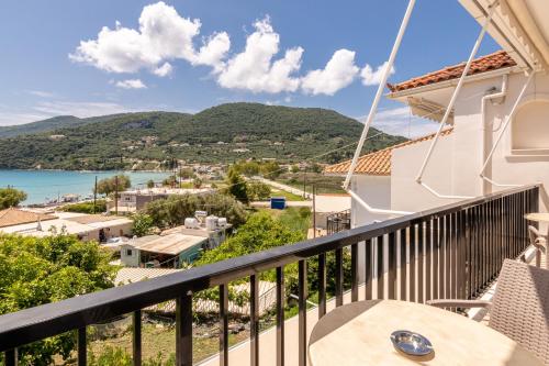 a balcony with a view of the ocean and mountains at Villa Regina in Keri