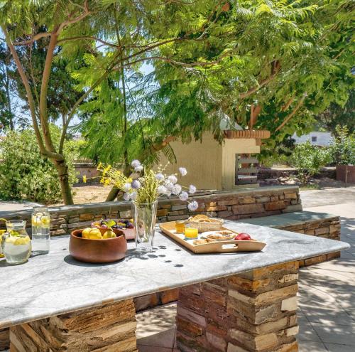 a table with food on top of it at The Secret Valley of Chora - 5 mins to Beach in Livádhia