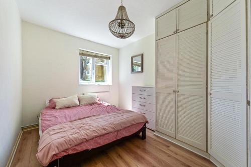 a bedroom with a bed and a dresser at 29 Smithwood close in London