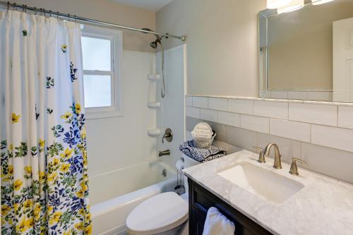 a bathroom with a sink and a toilet and a shower at Greensboro Vacation Rental 2 Mi to Downtown! in Greensboro