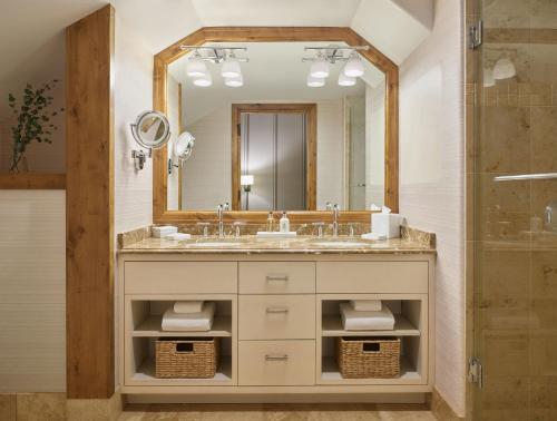 a bathroom with a sink and a mirror at The Sebastian - Vail in Vail