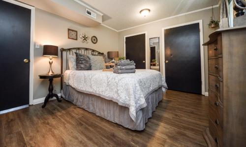 a bedroom with a bed and a dresser at Eclectic Abode in Cleveland