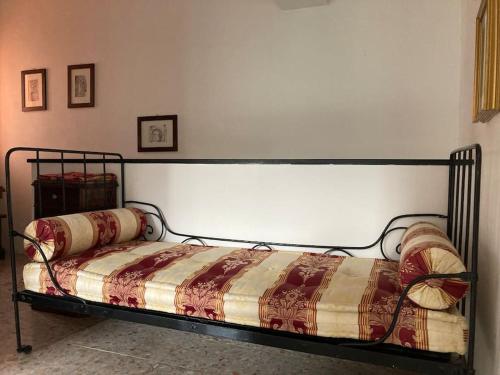 En eller flere senge i et værelse på Casa nel borgo - A Rigadèa