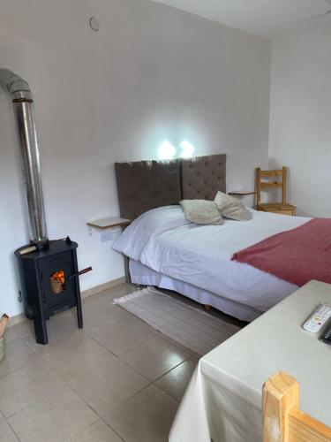 Postel nebo postele na pokoji v ubytování Cabañas & Apart Yki Shamuaika