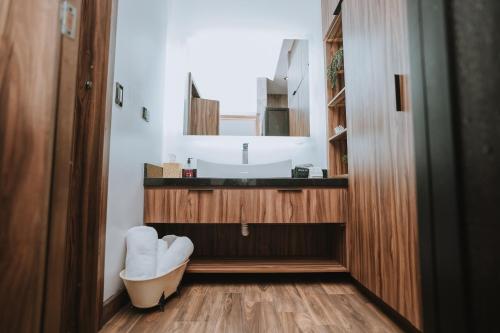 a bathroom with a sink and a mirror at Oasis 444 in San Marcos