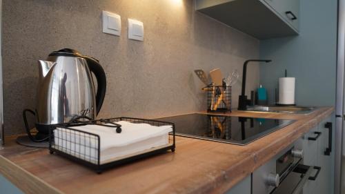 a kitchen counter with a coffee maker on it at Incanto Luxury House in Parga
