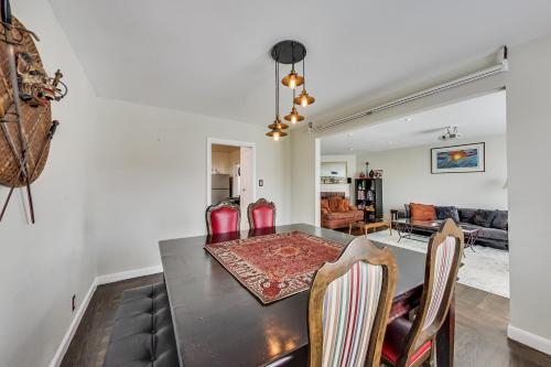 a dining room and living room with a table and chairs at Outer Sunset Home Sleeps 6 Parking Wd in San Francisco
