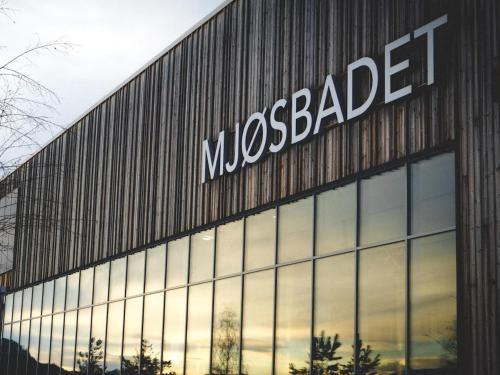 a mcedes benz building with a mcedesearcher sign on it at MJOS TOWER Apartment - Lovely city view in Ringsaker