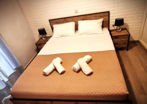 a bed with two pillows on top of it at Zeus in Gázion