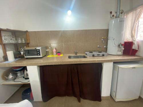 Kuchyň nebo kuchyňský kout v ubytování Cabañas & Apart Yki Shamuaika