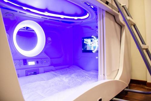 Postel nebo postele na pokoji v ubytování El Prado Capsule Hostel
