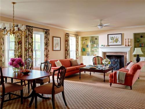 a living room with a couch and a table at The Langham Huntington, Pasadena in Pasadena