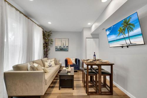 a living room with a couch and a table at Wellington Garden in West Palm Beach