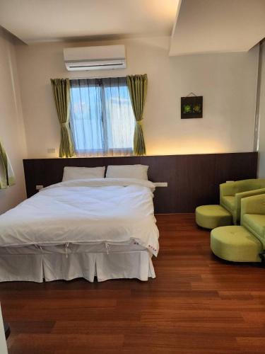 Ένα ή περισσότερα κρεβάτια σε δωμάτιο στο Hajin Homestay