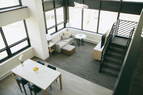 an overhead view of a living room with a couch and a table at Staybridge Suites Chicago O'Hare - Rosemont by IHG in Rosemont