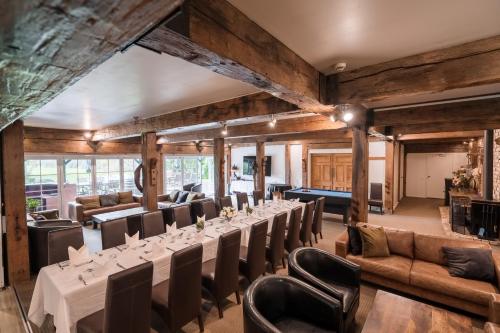 a large room with a long table and chairs at Northridge Golf Resort in Orewa