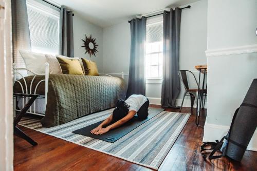 a child laying on a rug in a living room at East Stevens Home in Culpeper