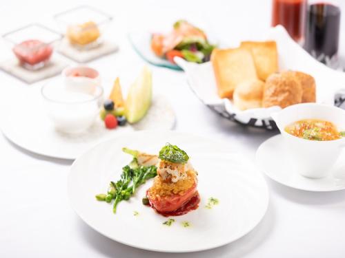 a white plate with food on a table at Nikko Nishimachi Club in Nikko