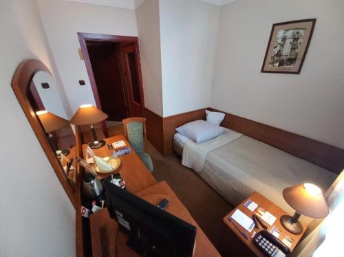 Un ou plusieurs lits dans un hébergement de l'établissement Hotel BAST Wellness & SPA