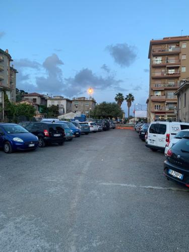 a parking lot with a lot of cars parked at Casa Viola vicino al mare by SMART-HOME in Vallecrosia