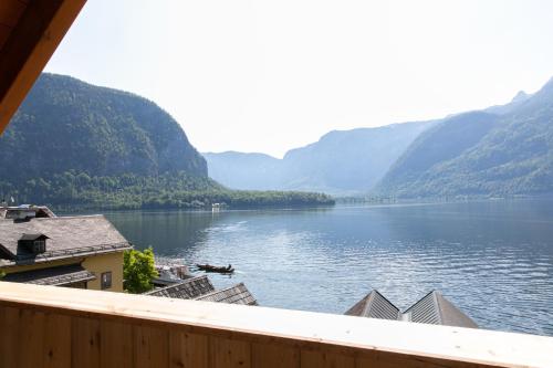 a view of a lake with mountains in the background at Weisses Lamm in Hallstatt