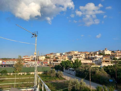 a view of a city with buildings in the background at Wooden Home in Ermioni