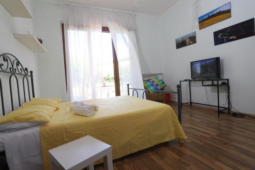 Letto o letti in una camera di Casa Sophie Affittacamere