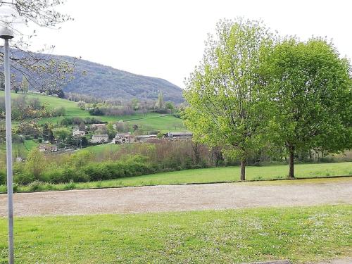 a street light in a field with a tree at Logement standing wifi Vercors 'In in Saint-Jean-en-Royans