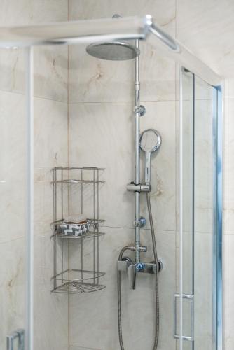 a shower in a bathroom with a glass door at Villa P3 Paradise in Arménoi